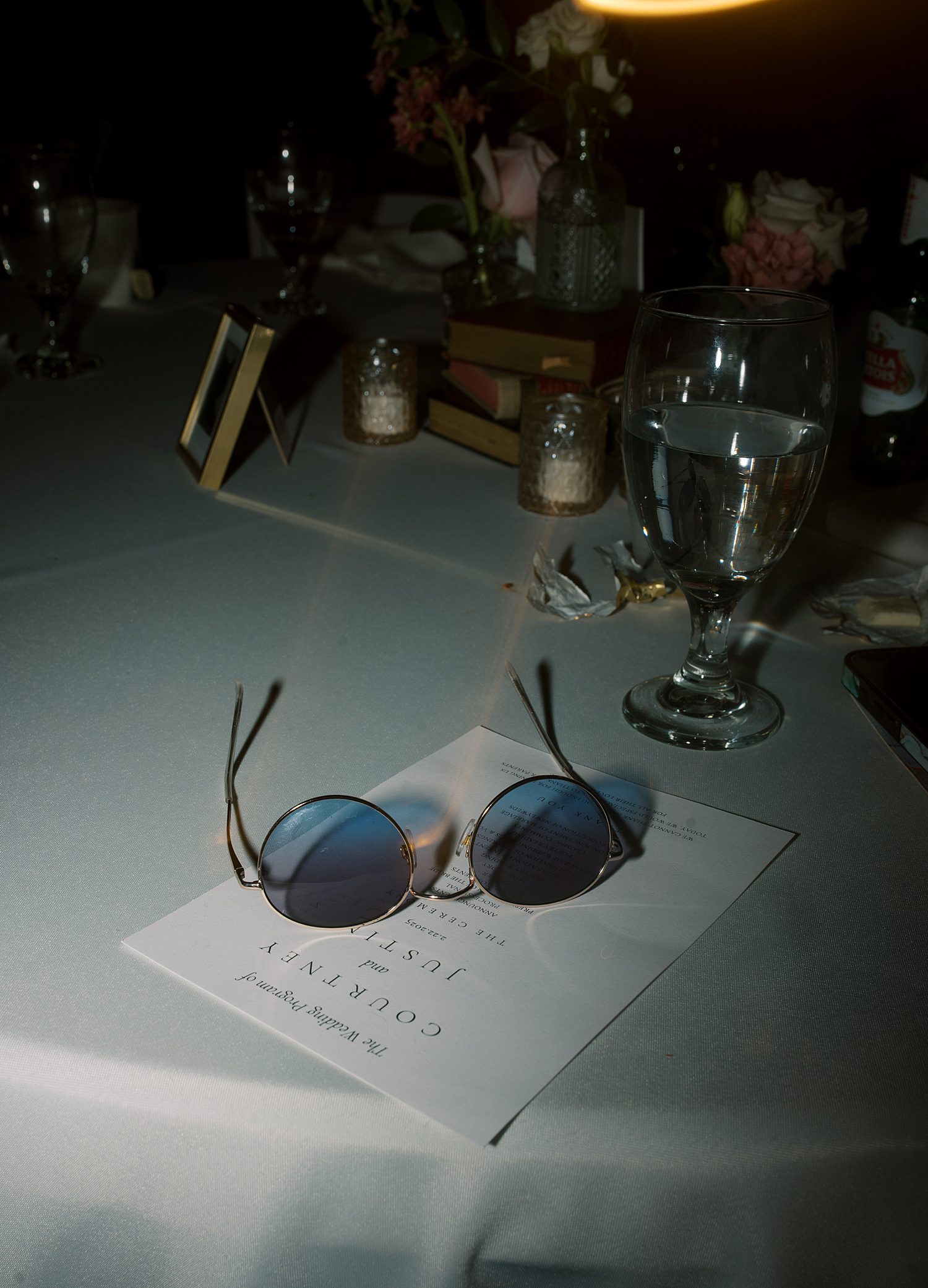 sunglasses rest on menu card on table 