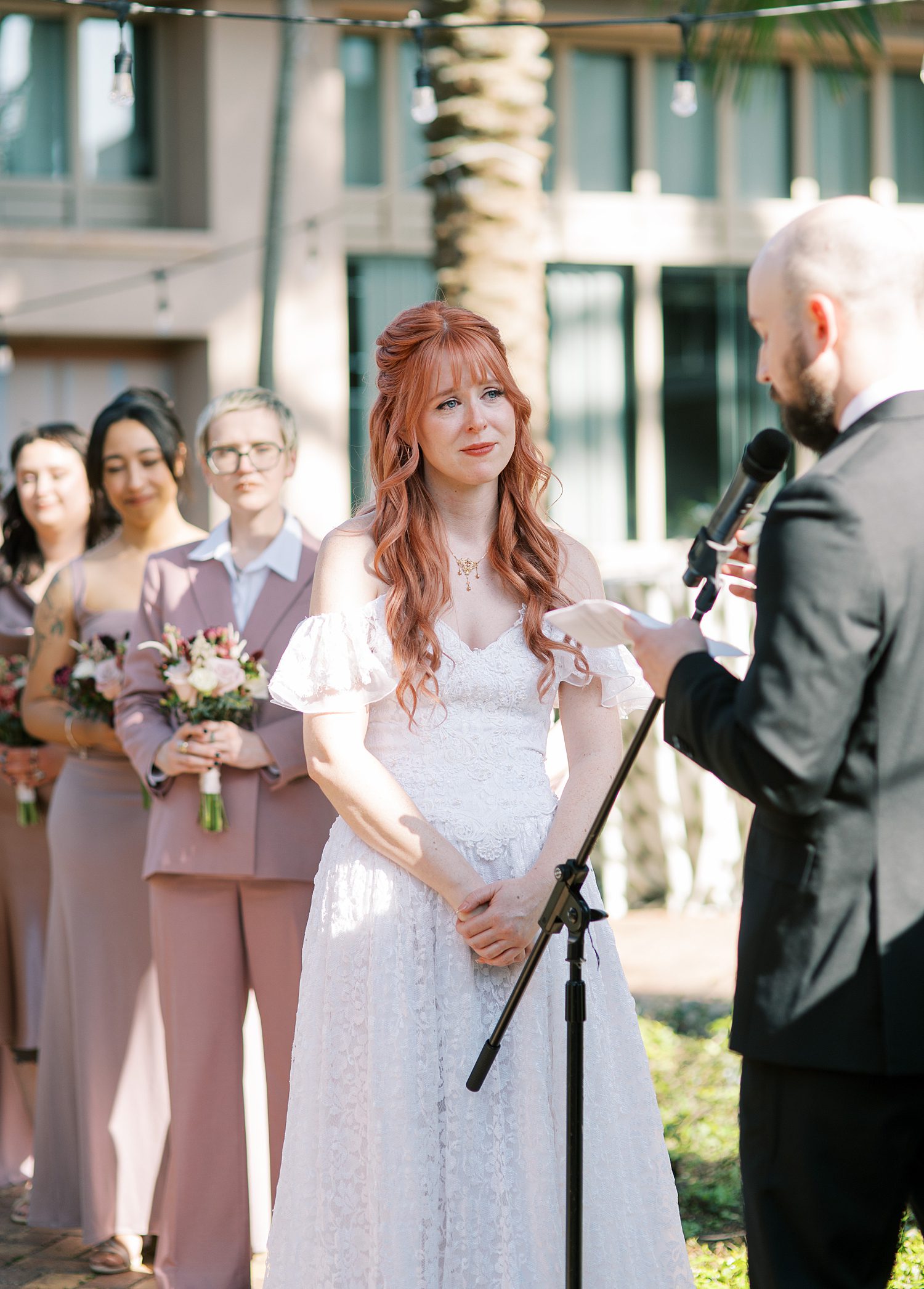 bride listens to groom's personal vows