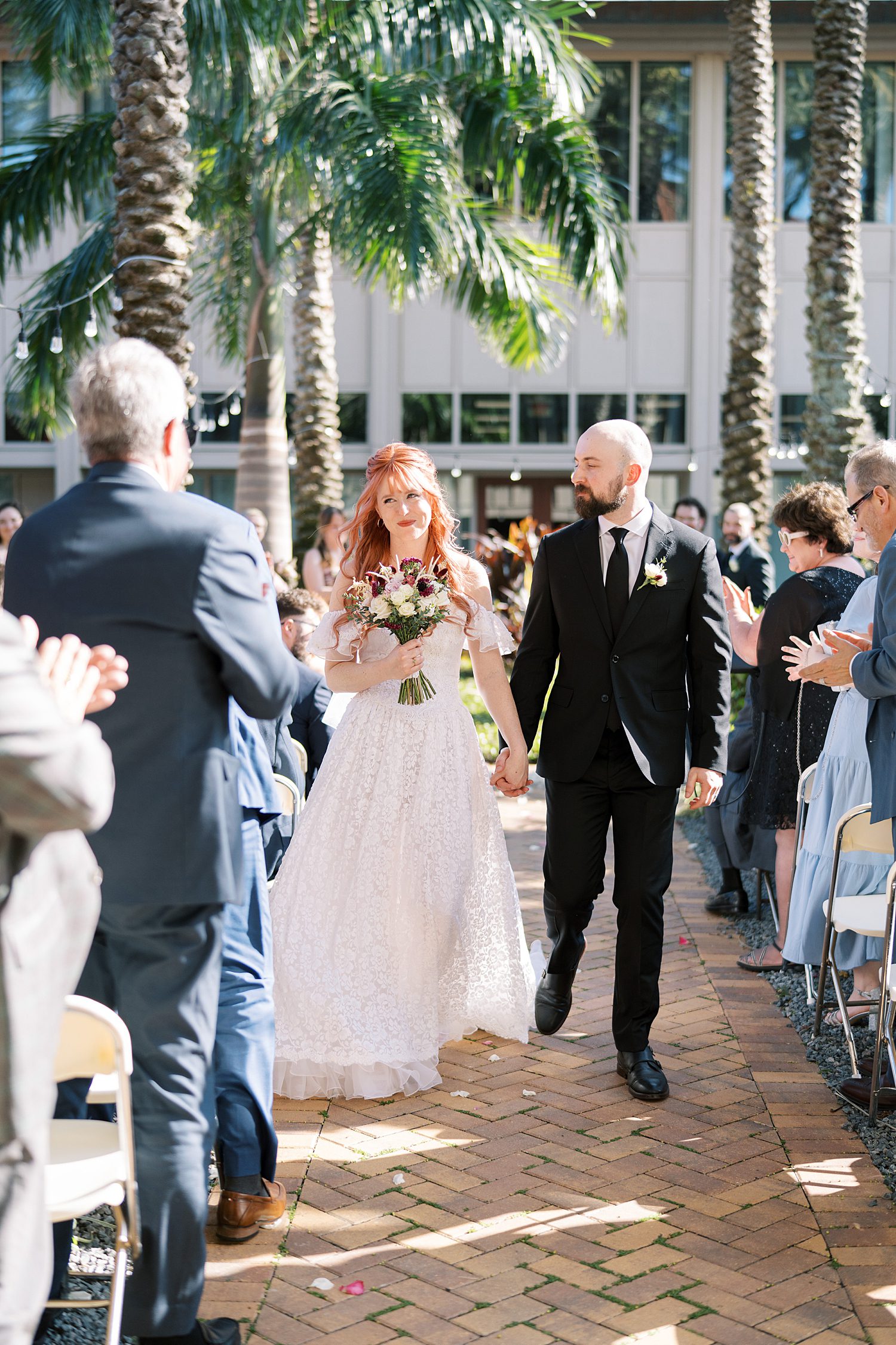 newlyweds exit wedding ceremony. 