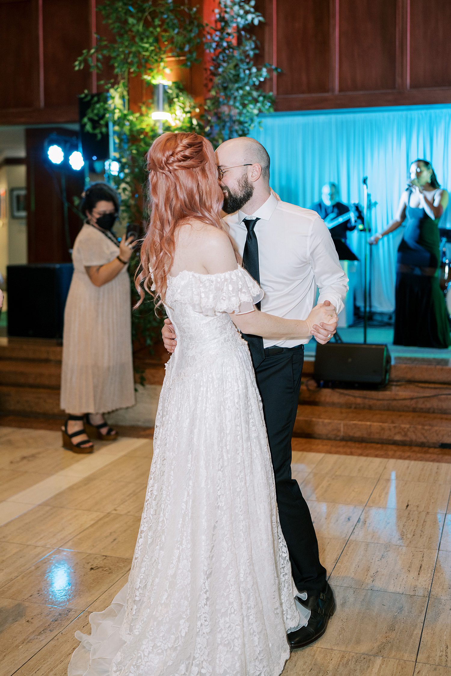 candid wedding photos of couple on dance floor 