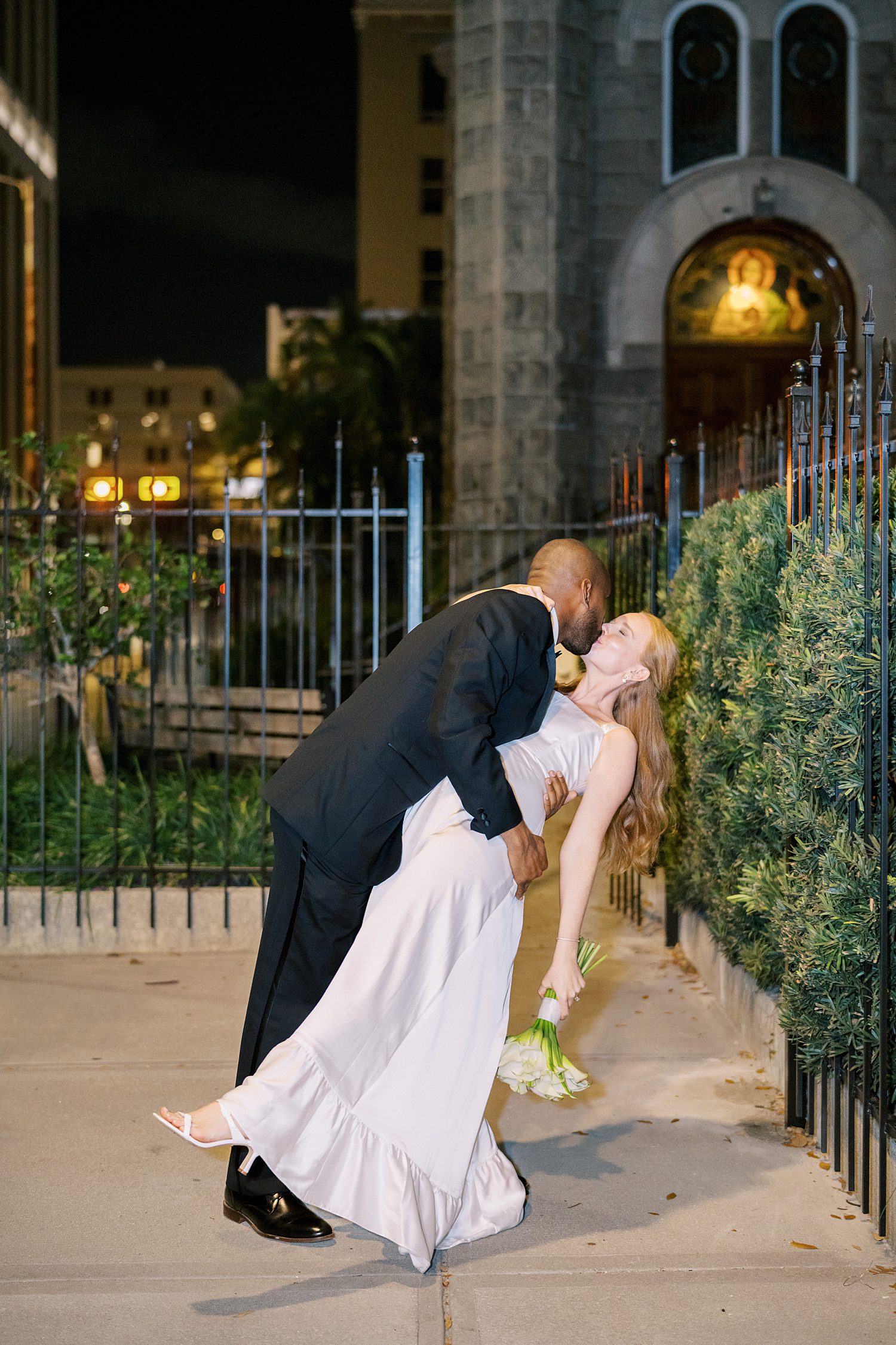 groom dips his bride after Tampa wedding