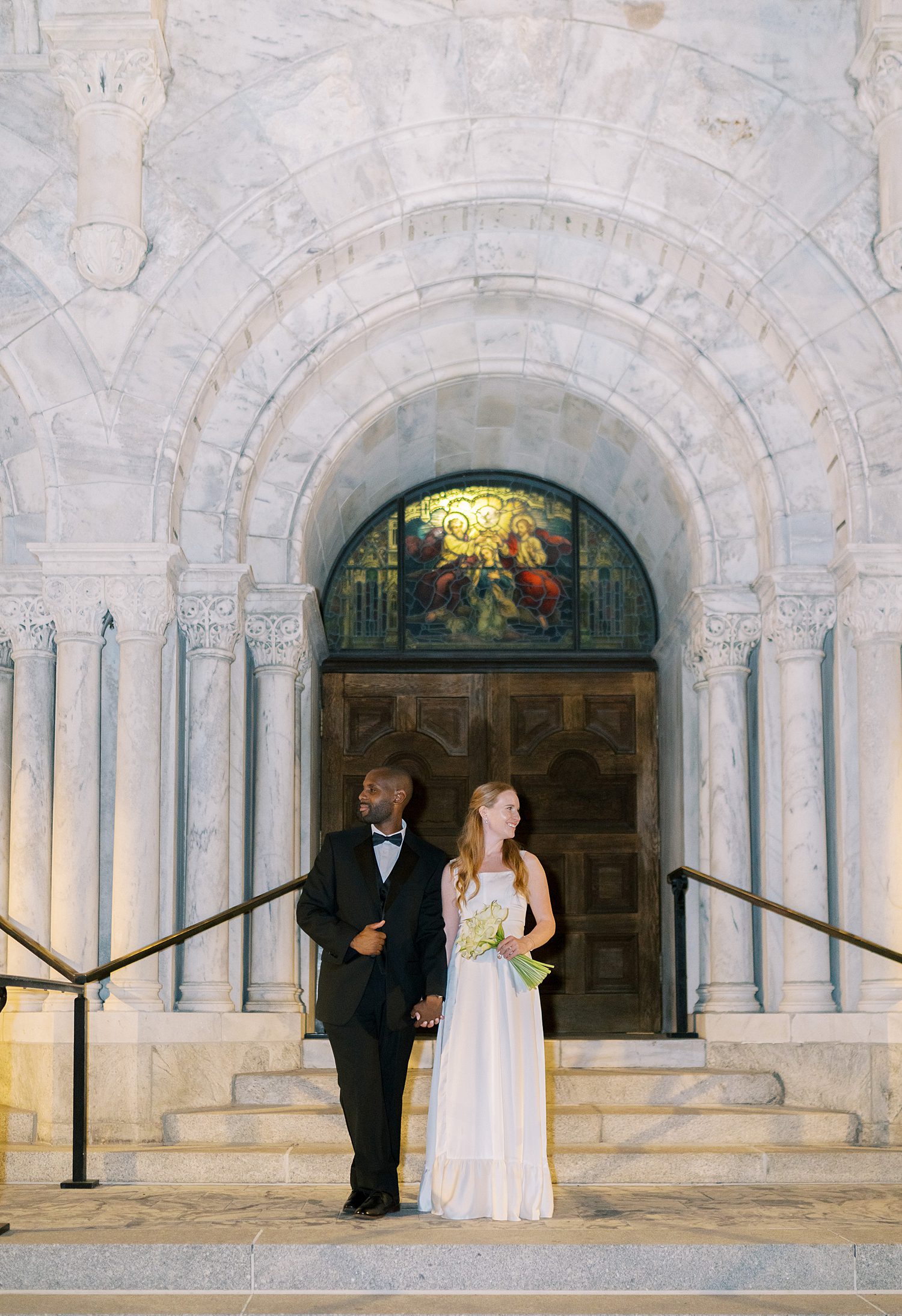newlyweds outside of Catholic church in Tampa