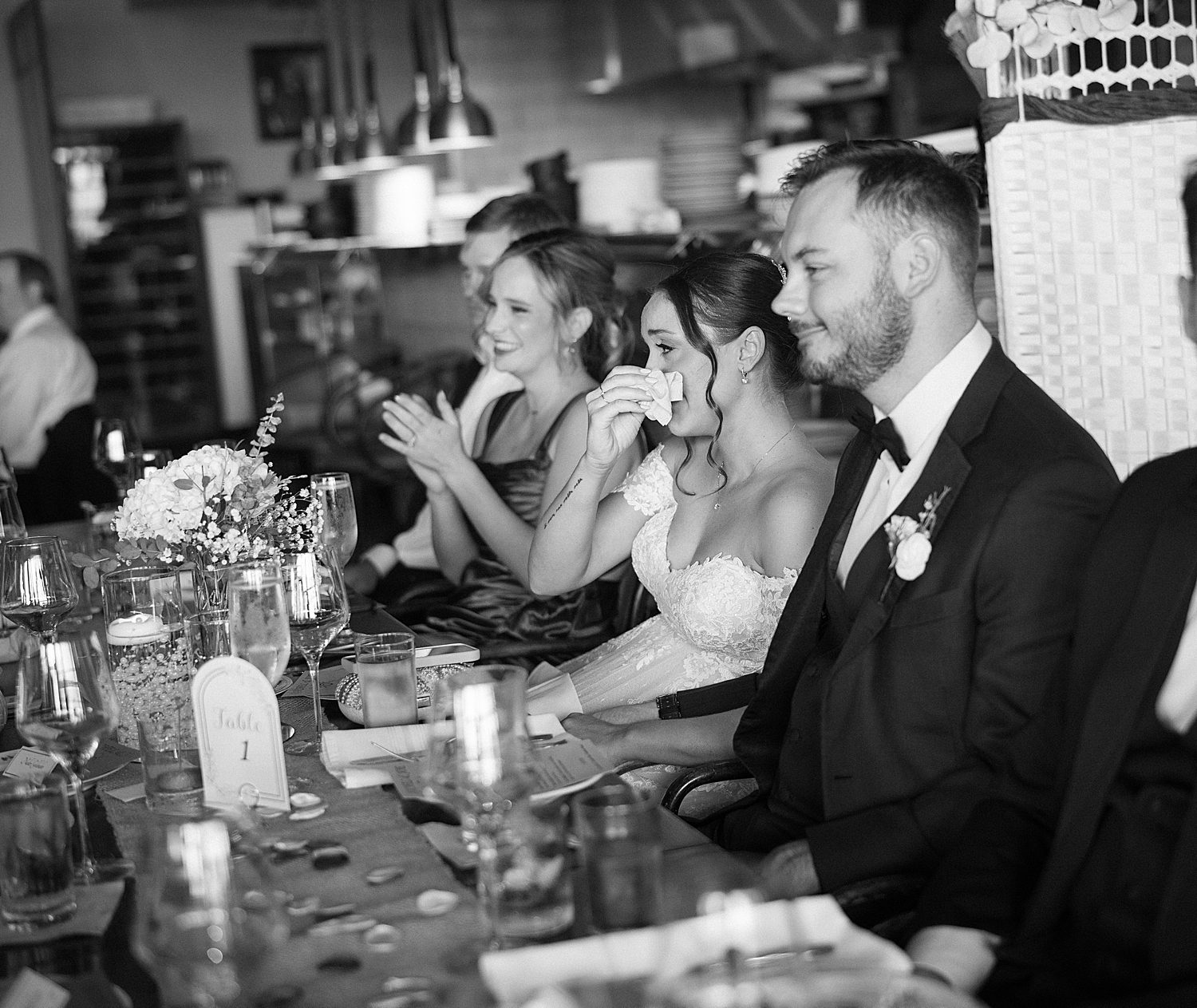 bride wipes away tears during heartfelt speeches 