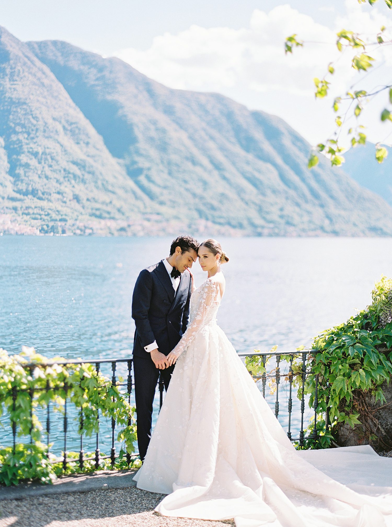 waterfront wedding portraits with mountains in the distance