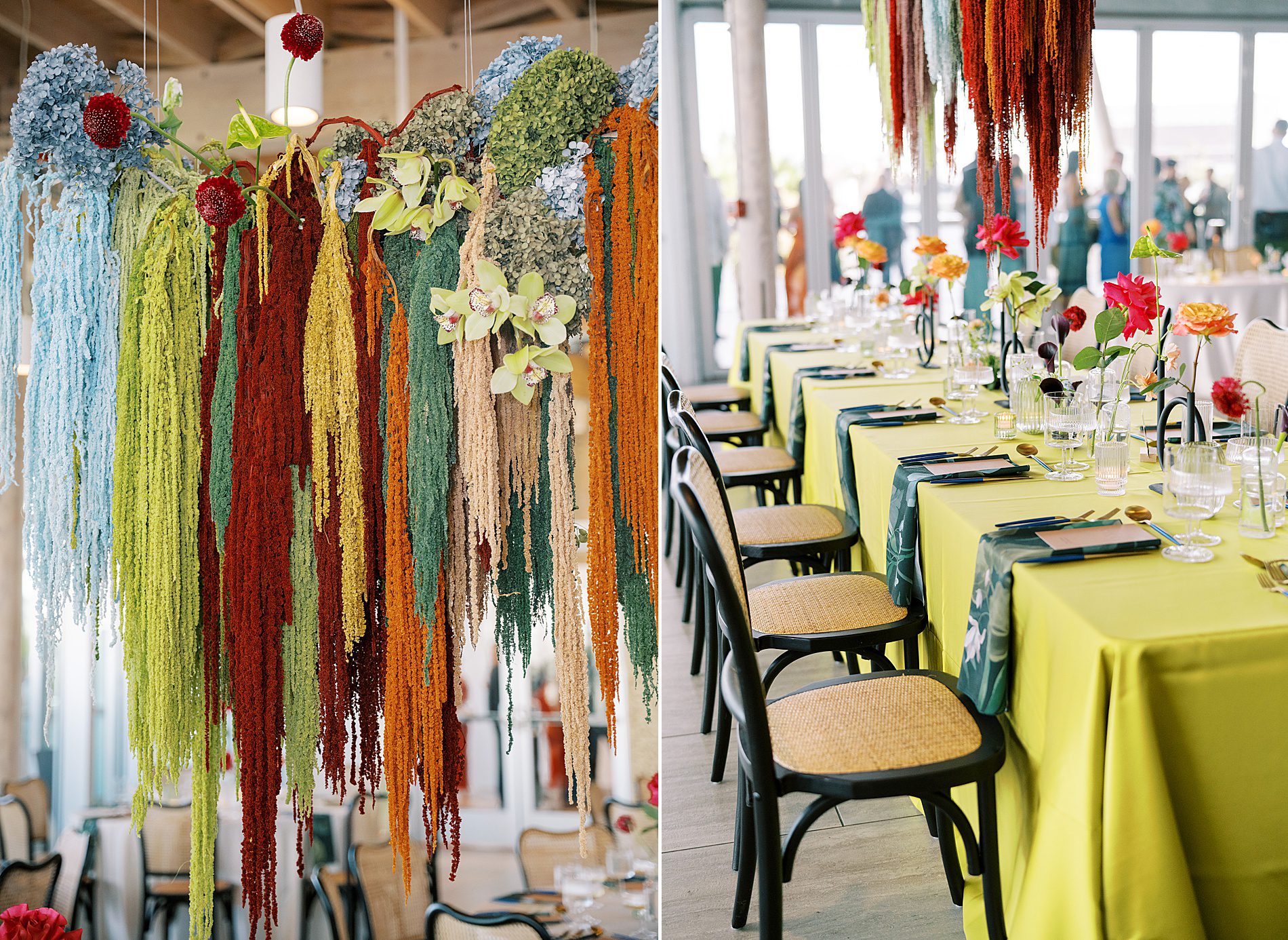 colorful wedding flower installation suspended over tables at reception 