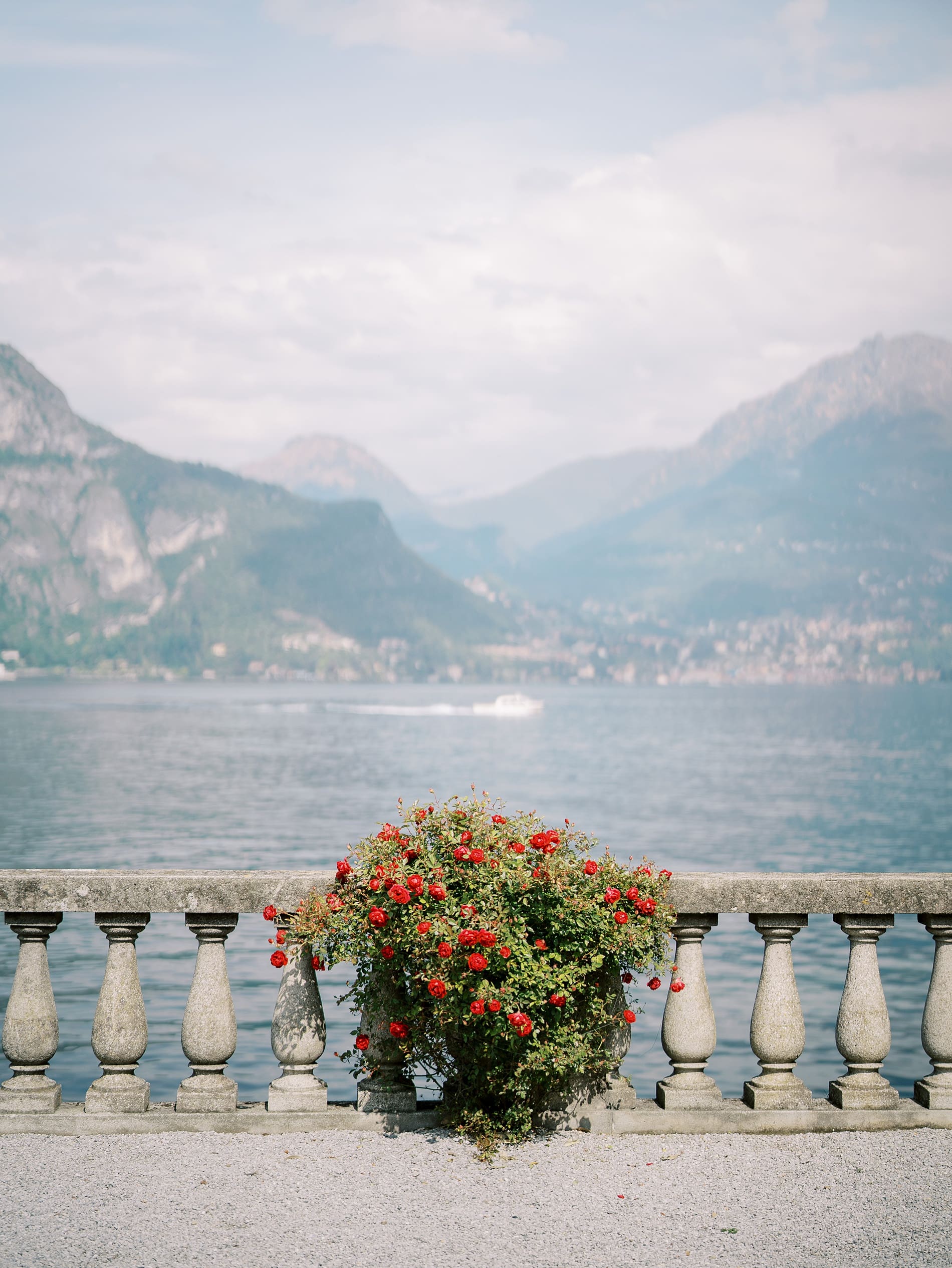 waterfront views of Lake Como with mountains in the distance 