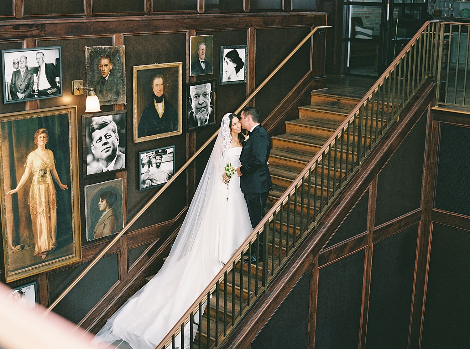 bride and groom on staircase 