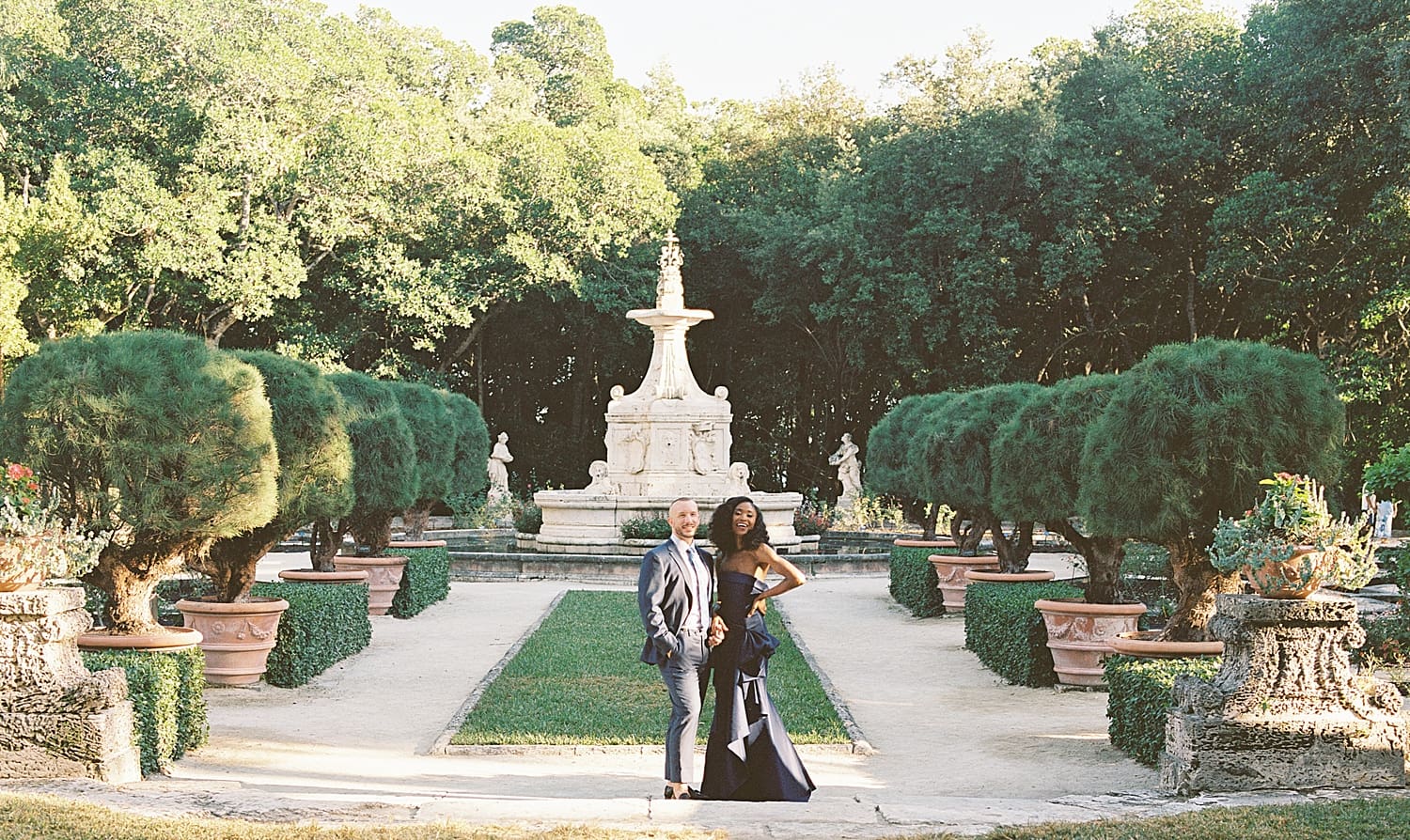 engaged couple in garden at Vizcaya Museum 