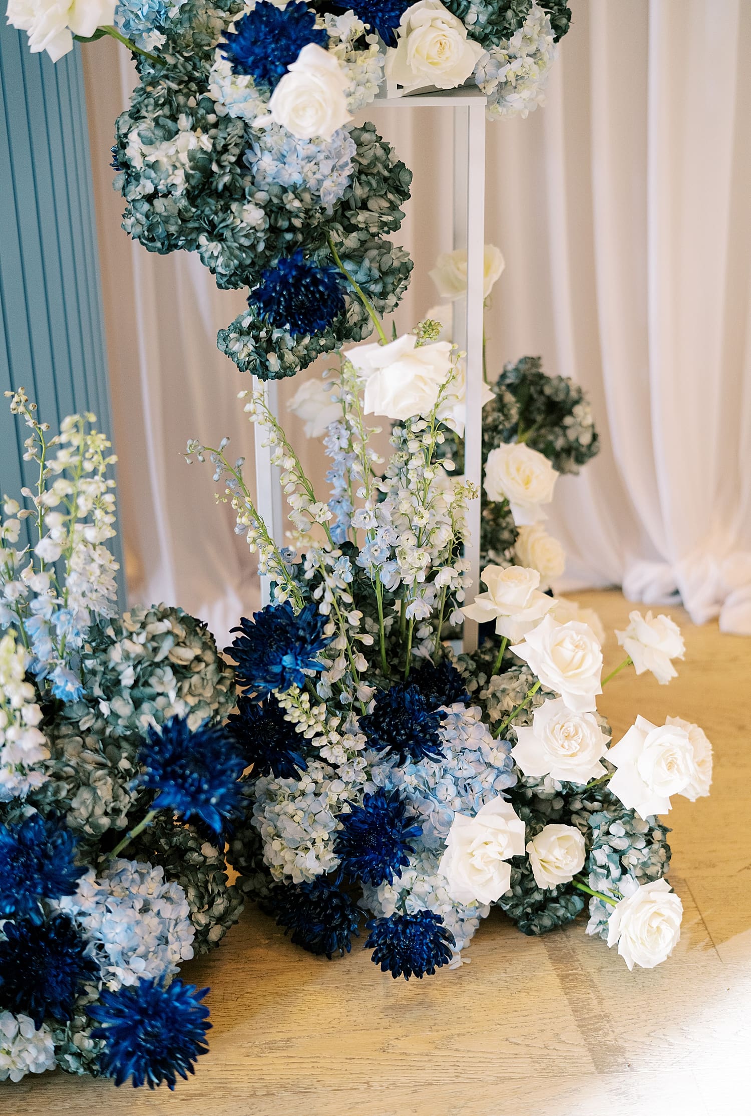 light and dark blue flowers mixed with white to decorate event space at The Edition Tampa 