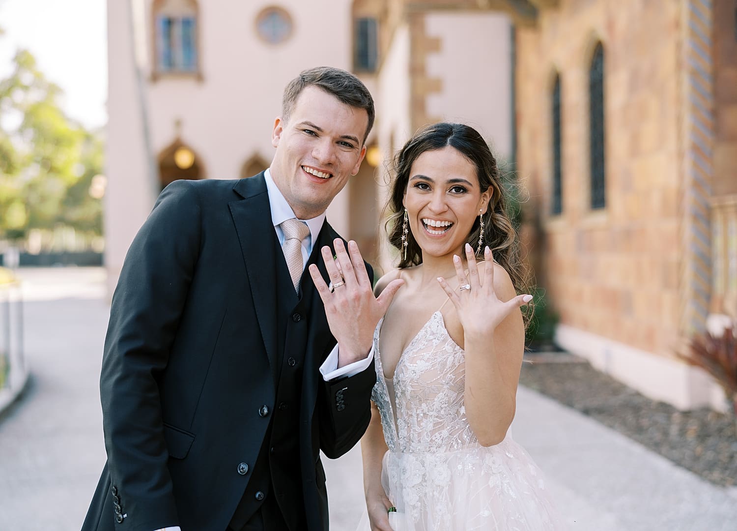 Newlyweds show off their wedding rings
