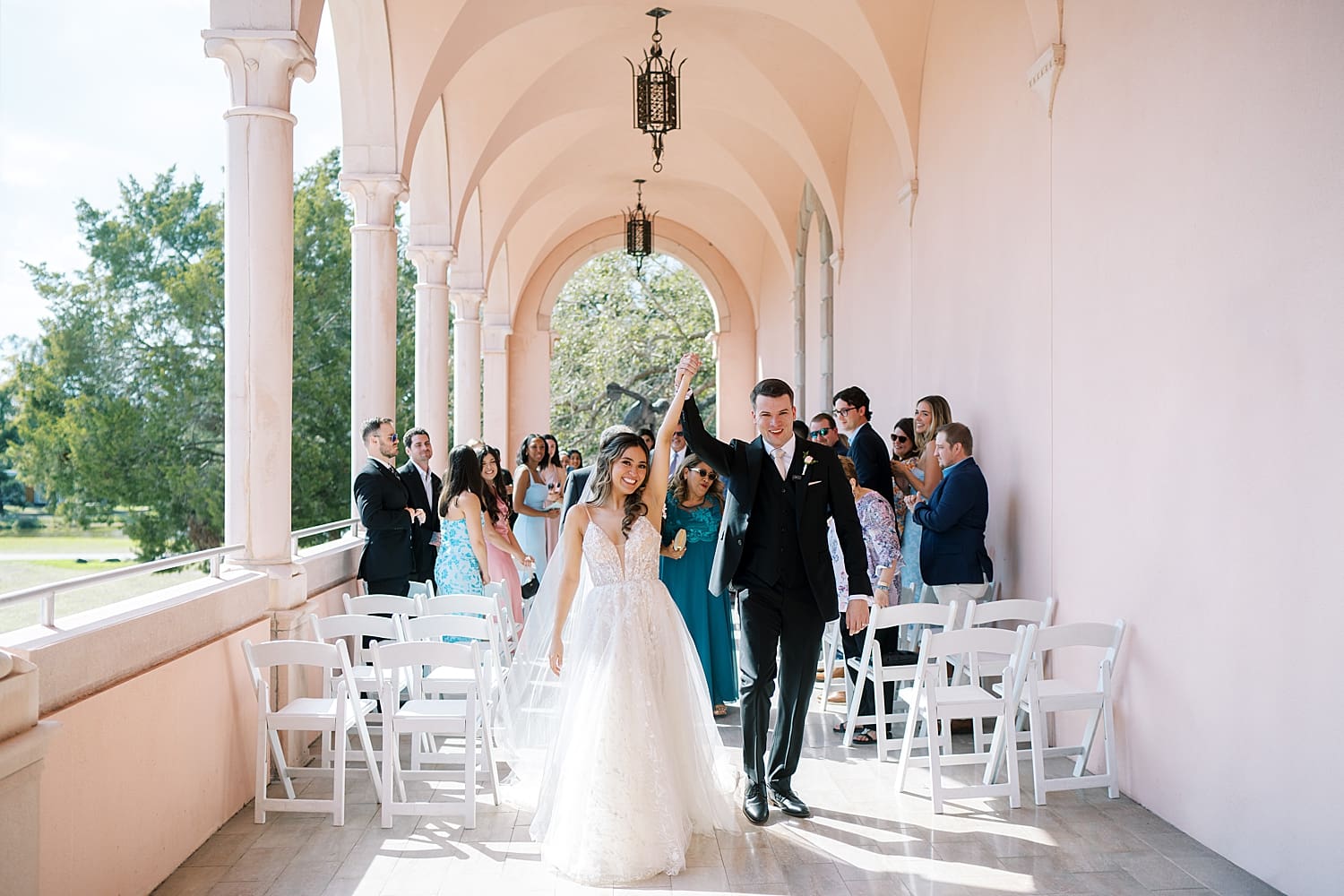 newlyweds exit micro wedding at The Ringling Museum of Art
