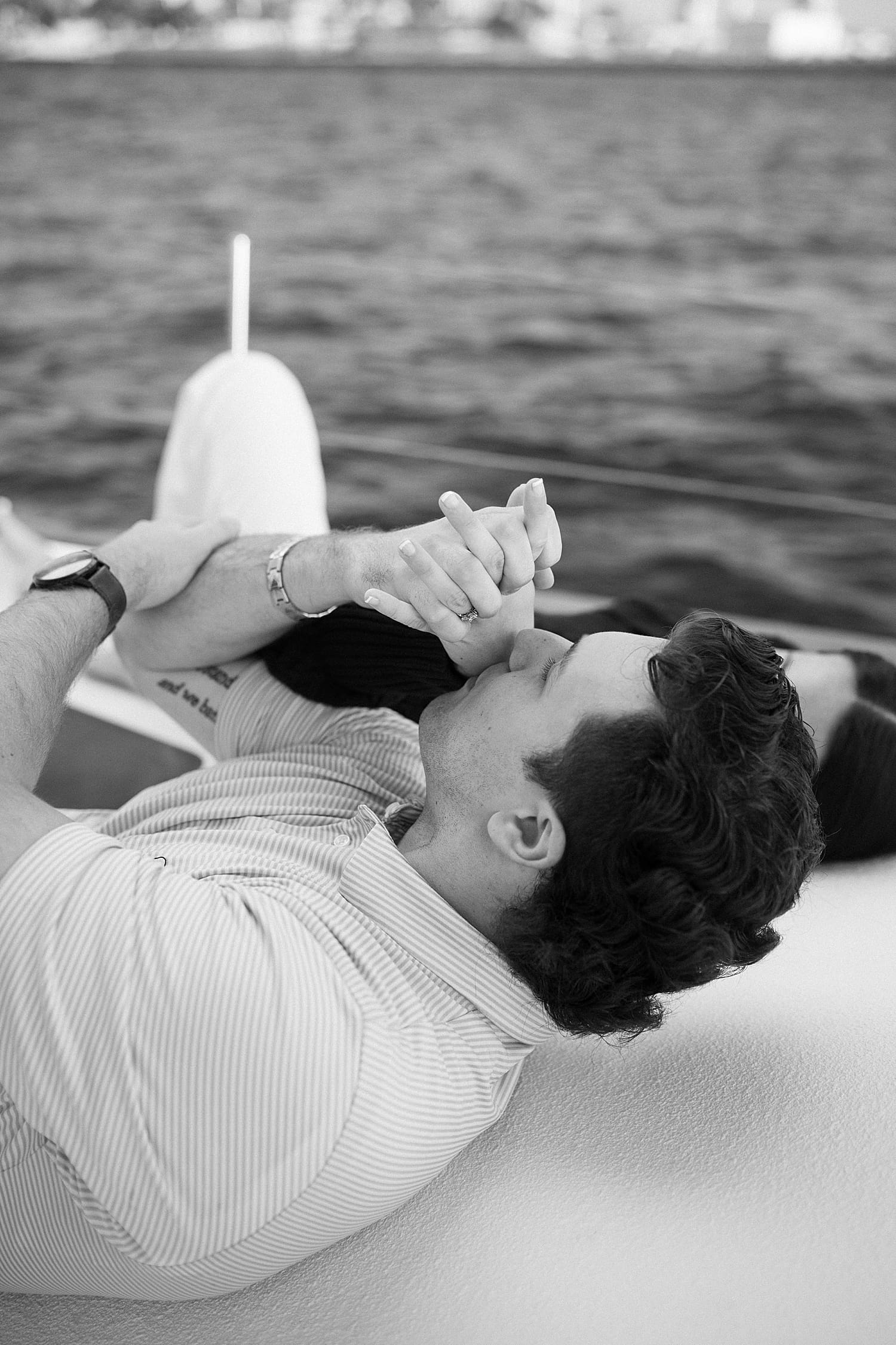 timeless engagement photos of man kissing fiance's hand