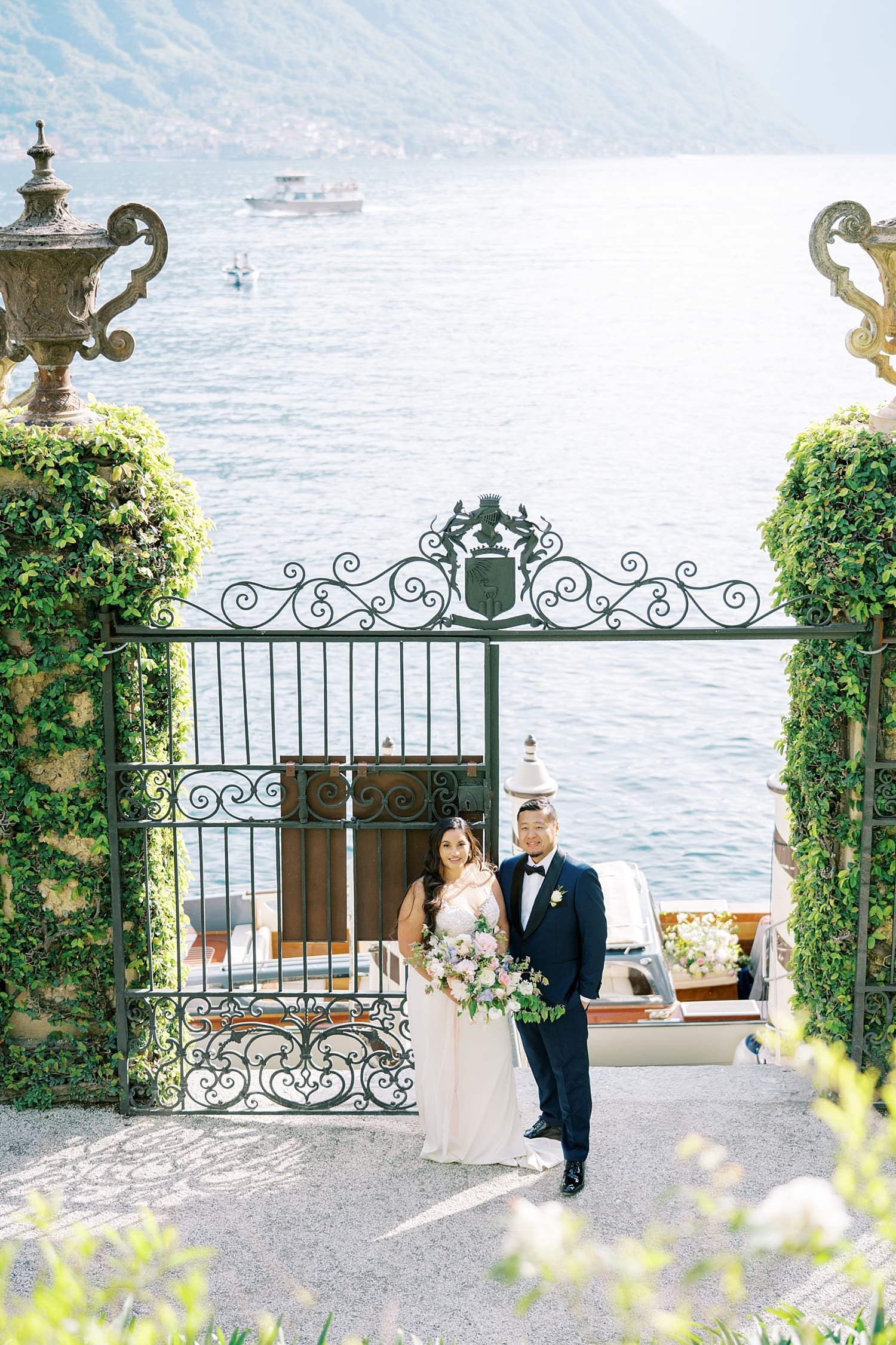 newlyweds stand by Lake Como |. Villa del Balbianello Weddings Guide  