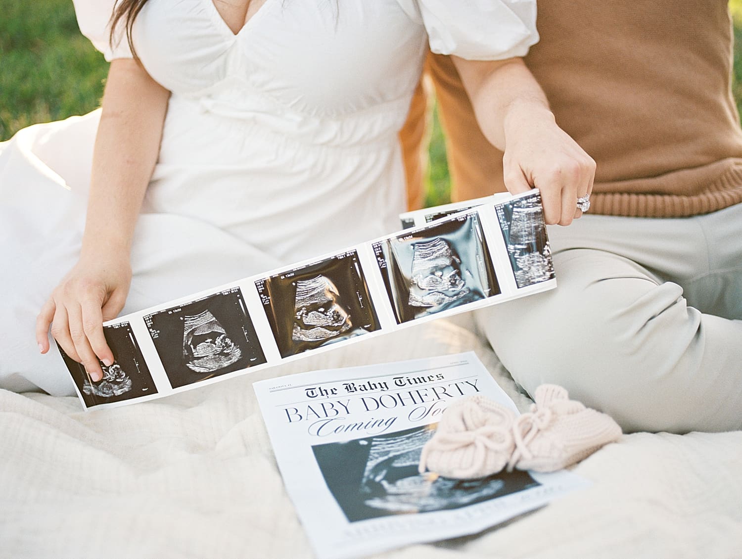 Maternity Session in Downtown Tampa with couple holding sonogram photos