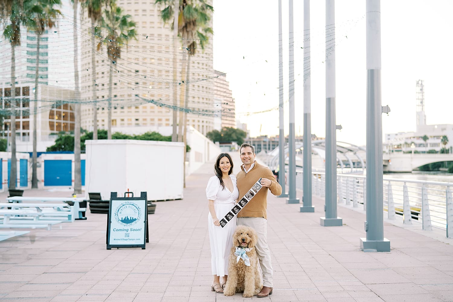 Maternity Session in Downtown Tampa at The Riverwalk with couple and their dog