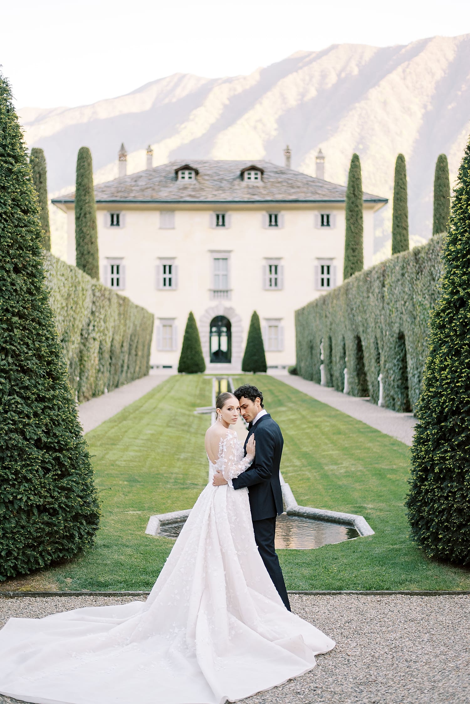 Lake Como wedding guide at Villa Balbiano | Bride and groom at lakeside lawn
