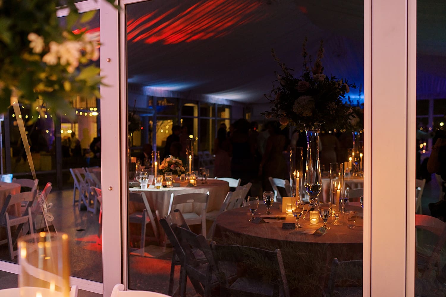 tented reception at night light by candlelight