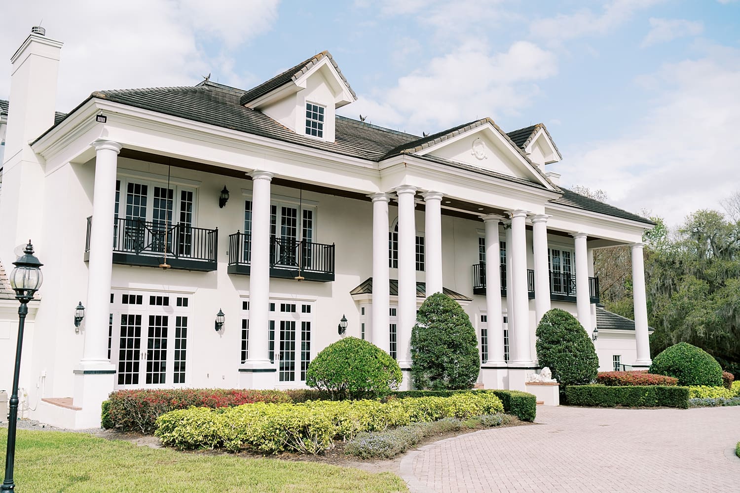 outside of Luxmore Grande Estate in Winter Springs, FL, a luxurious wedding venue