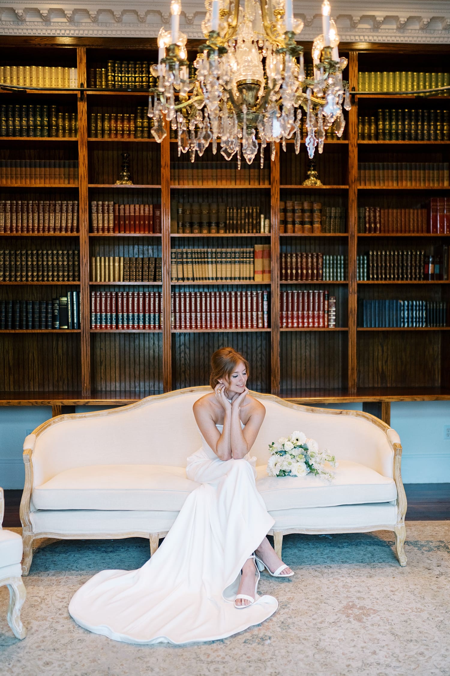 timeless wedding photos of bride in library of Luxmore Grande Estate, an elegant southern wedding venue in Central FL