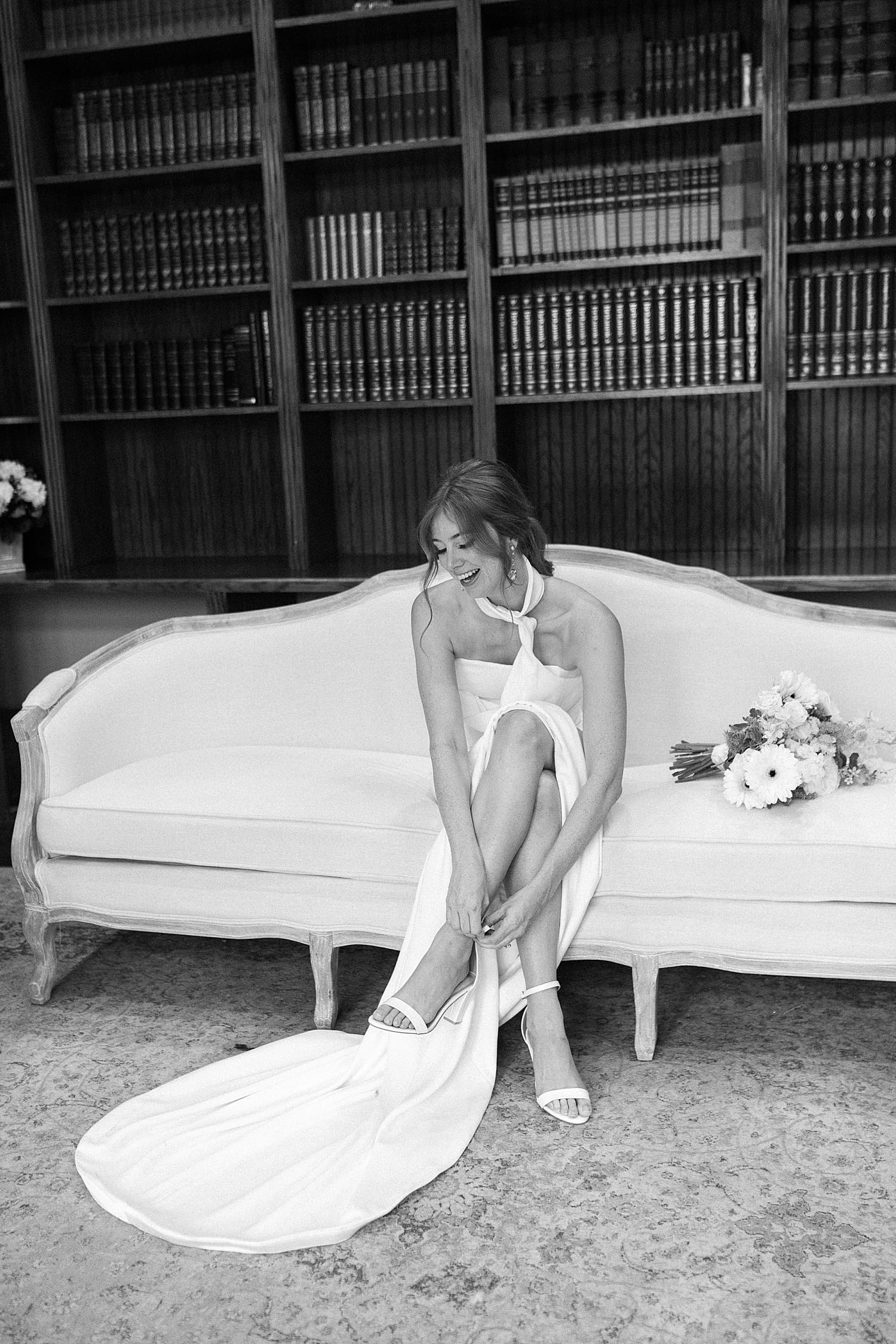 bride getting ready in library of Luxmore Grand Estate in Central Fl