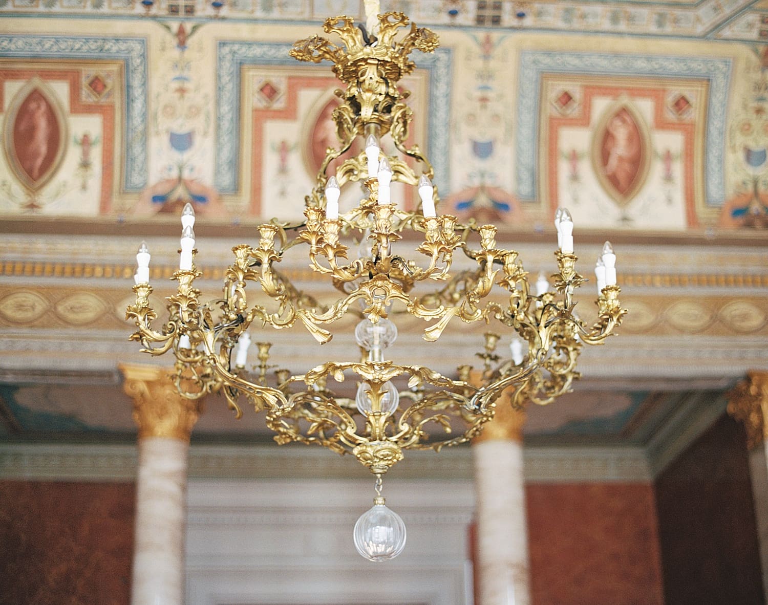 gold chandelier hangs in great room of Villa Serbelloni