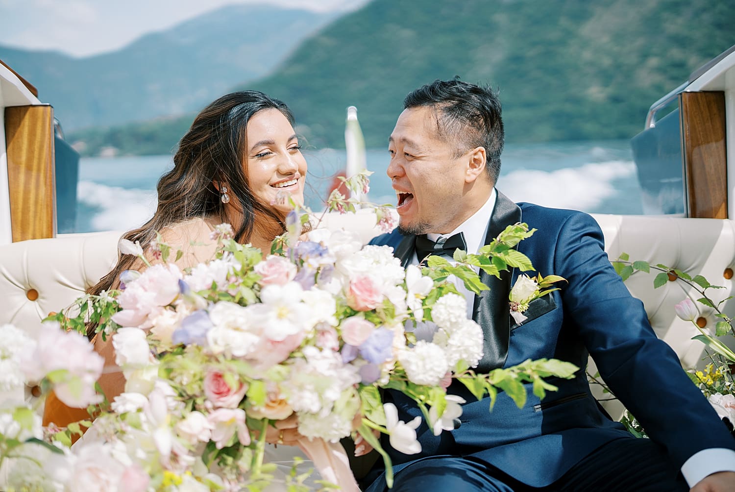 candid wedding photos of couple on private boat ride to Villa del Balbianello